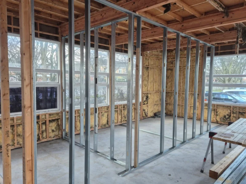 Metal supports inside a temporary building.